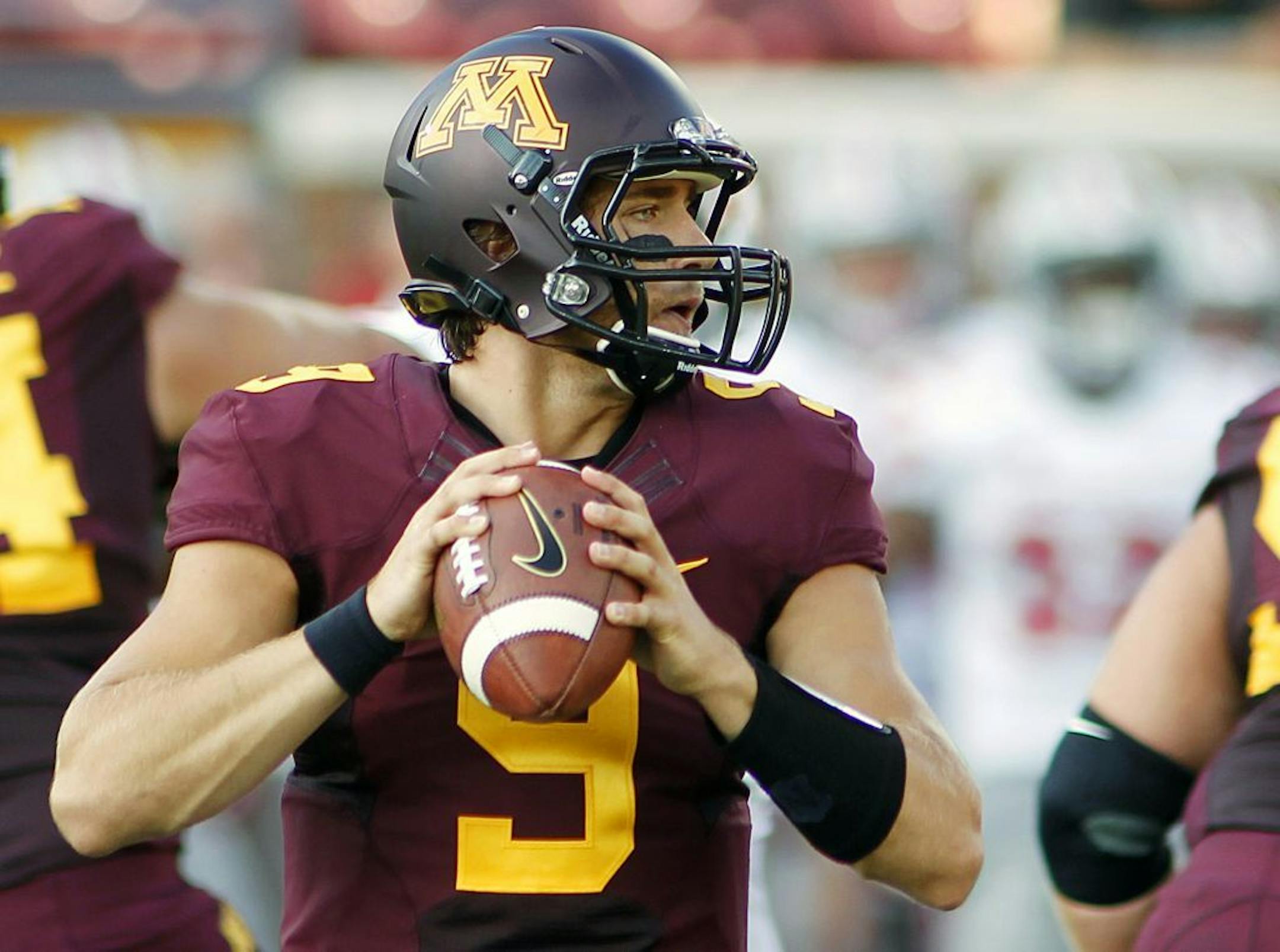 Minnesota quarterback Philip Nelson (9)