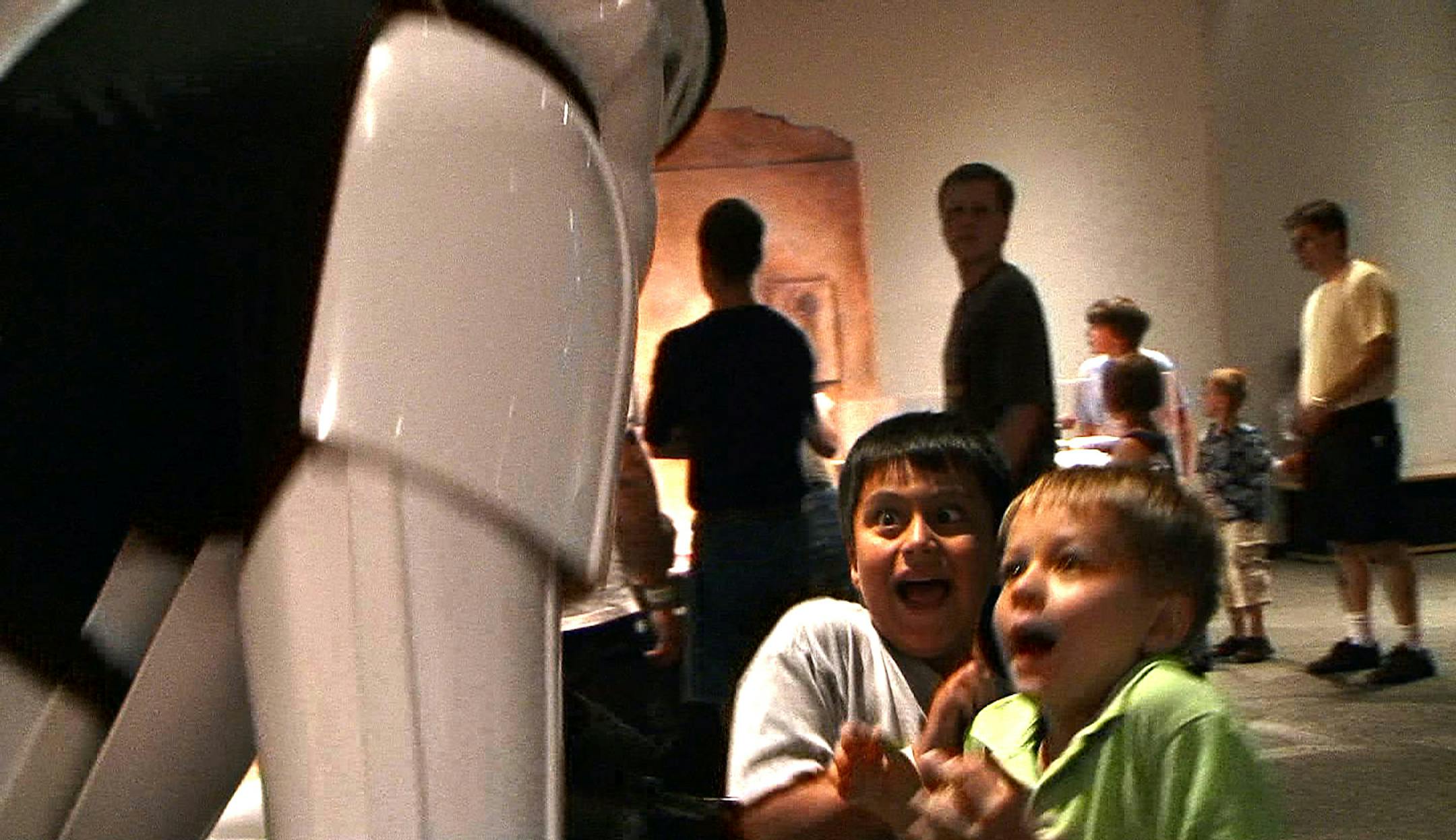 Adam Brown, 6, left, and Sam Liang, 6, both of St. Paul, were surprised to find a real person — Steve Carter, 56, of Woodbury — behind what they thought was a static stormtrooper outfit during a visit to the Science Museum of Minnesota. "It freaked us both out," Adam said.