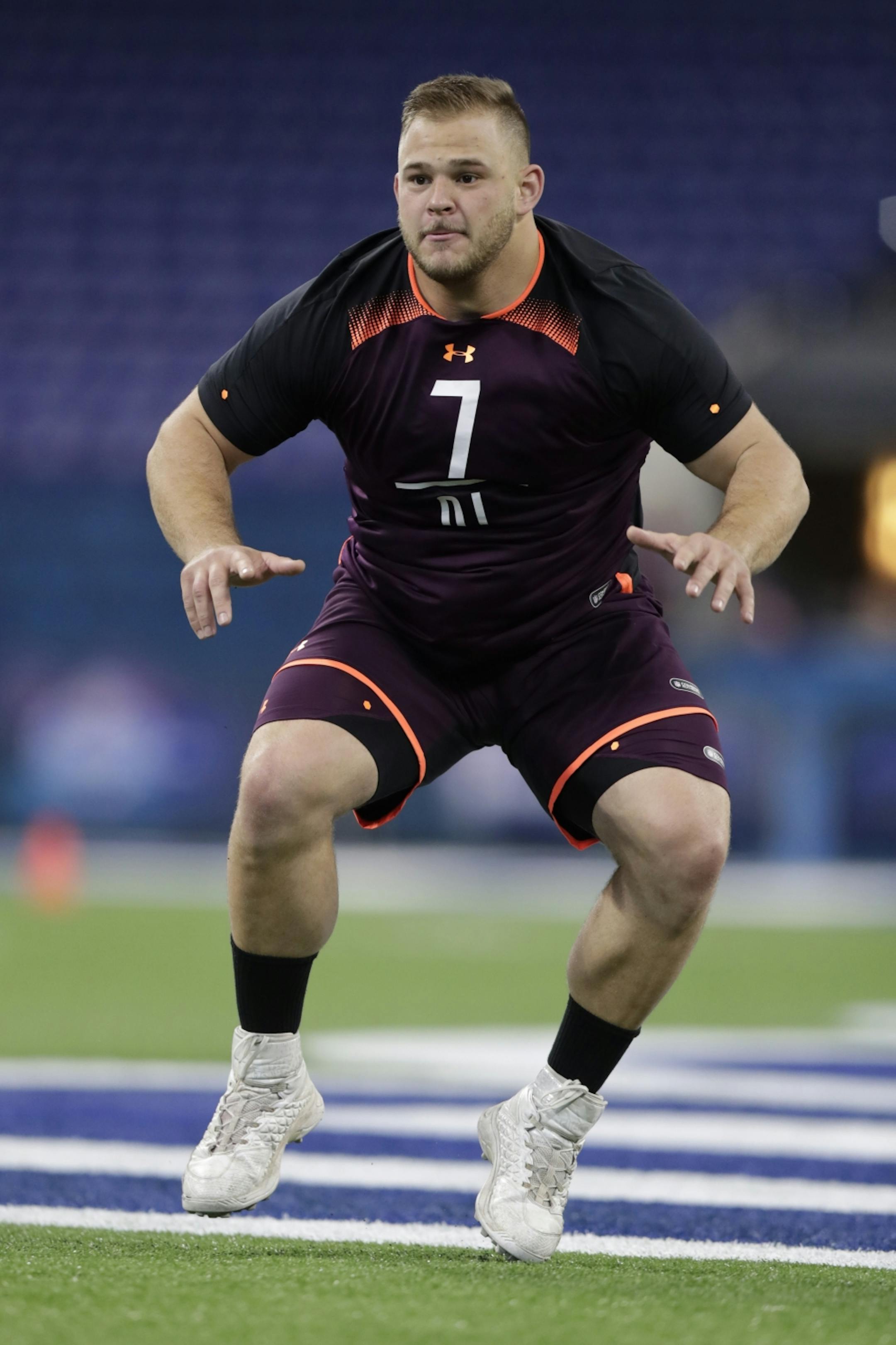 NC State offensive lineman Garrett Bradbury runs a drill at the NFL football scouting combine in Indianapolis, Friday, March 1, 2019.