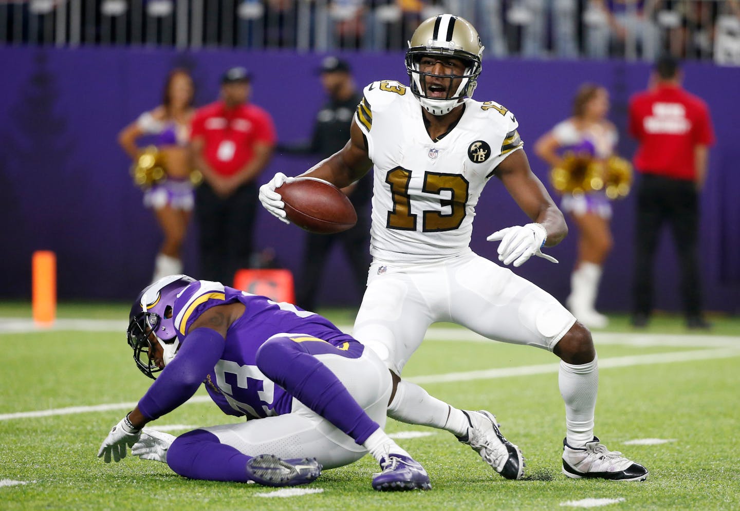 New Orleans Saints wide receiver Michael Thomas (13) celebrates after catching a pass in front of Minnesota Vikings strong safety George Iloka, left, during the first half of an NFL football game, Sunday, Oct. 28, 2018, in Minneapolis. (AP Photo/Bruce Kluckhohn)