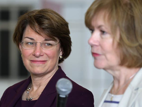 U.S. Senator Amy Klobuchar listened as Minnesota Lt. Gov. Tina Smith discussed details of an upcoming trade mission to Cuba. ] Shari L. Gross &#xef; s