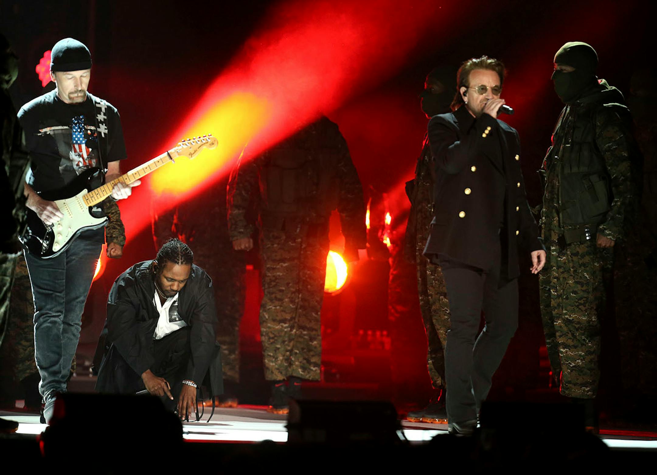 The Edge, left, and Bono, right, of U2, perform with Kendrick Lamar, second left, at the 60th annual Grammy Awards at Madison Square Garden on Sunday, Jan. 28, 2018, in New York.