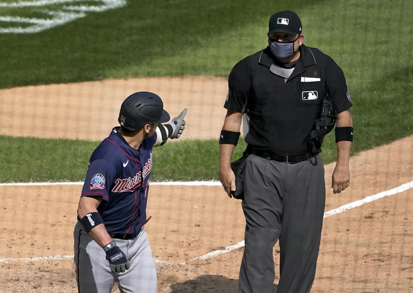 Minnesota Twins' Josh Donaldson gives home plate umpire Dan Bellino the thumbs up sign after Bellino ejected him from the baseball game during the sixth inning against the Chicago White Sox, Thursday, Sept. 17, 2020, in Chicago. (AP Photo/Charles Rex Arbogast)