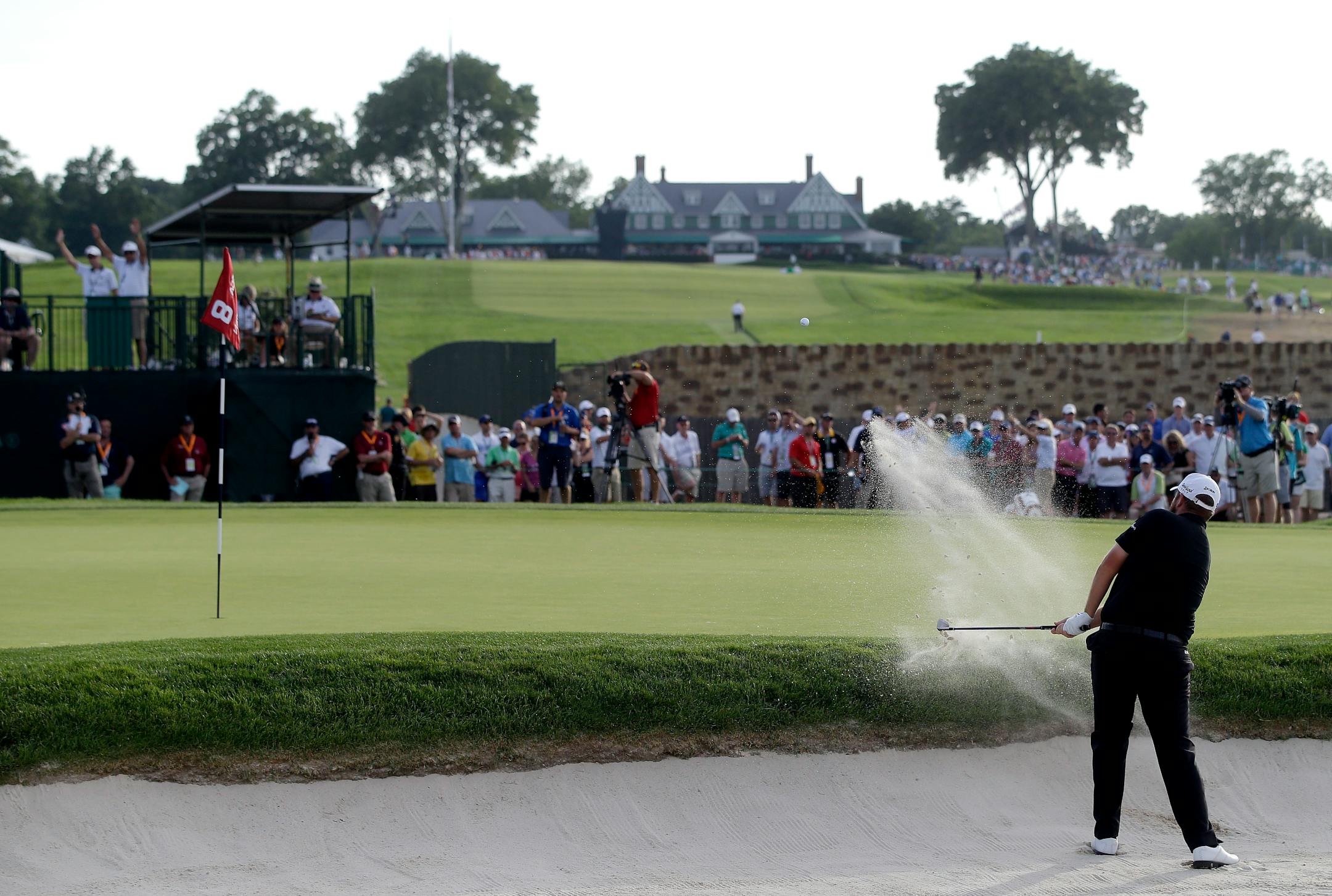 Shane Lowry hit out of the bunker on the eighth hole during the third round of the U.S. Open at Oakmont Country Club on Saturday.