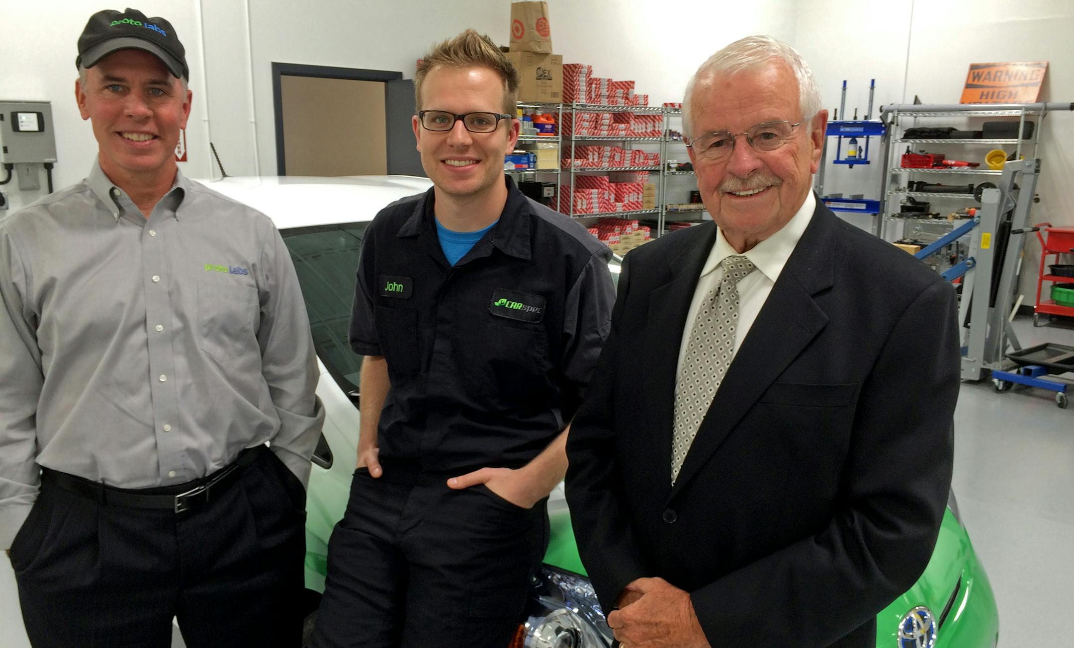 Brad, John and David Cleveland at John's CARspec auto-repair shop in Eden Prairie.