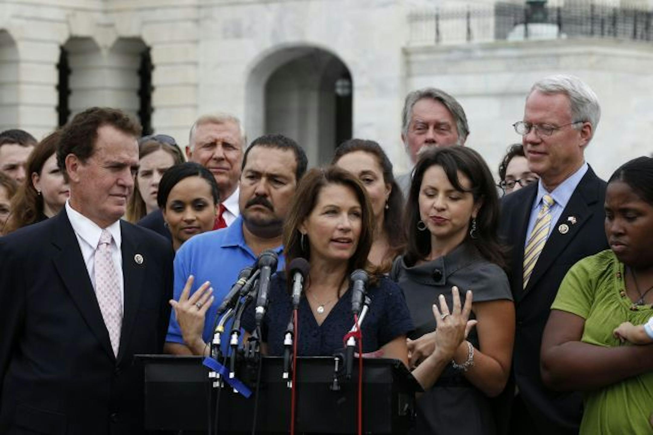 Tea Party caucus leader Rep. Michele Bachmann, R-Minn., center, speaks at a news conference on Capitol Hill in Washington on Wednesday.