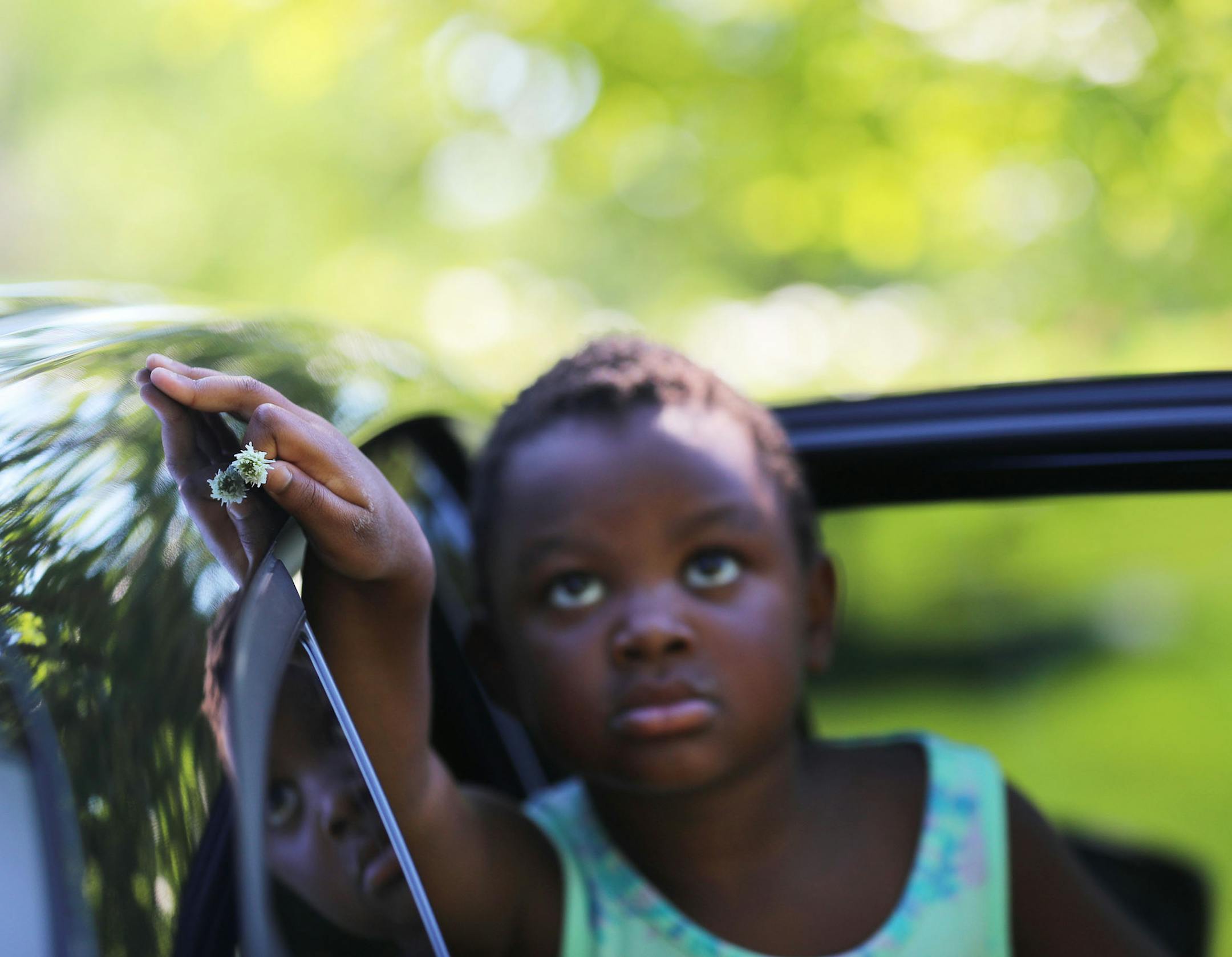 During a visit to her mother's grave site with her father Rob Raub, Ruby Raub, 4, paused with a clover flower she had picked near Emily Hofher's grave Sunday, July. 12, 2020, in Minneapolis. ] DAVID JOLES • david.joles@startribune.com Friday, Sept. 18, 2020, in Minneapolis, MN. 42-year-old Emily Hofher was planning her wedding and parenting a 2-year-old when she was diagnosed with cancer. She died less than three years later. Her widow, Rob Raub, shares his experience developing a relationship w