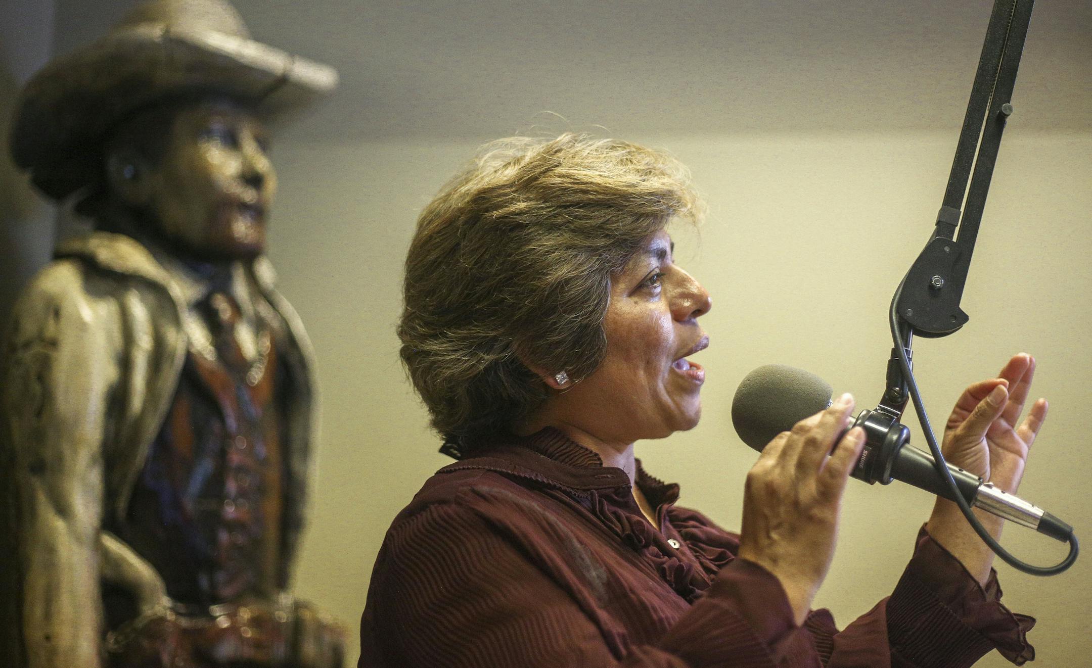 Lucina Gonz&#xe1;lez Mir&#xf3;n speaks during the show. ] Timothy Nwachukwu &#x2022; timothy.nwachukwu@startribune.com Radio show "El Super Barrio Latino" goes live at KYMN Radio on Sunday, July 31, 2016 in Northfield. The show began in February 2016 to create a sense of community for Latinos in the Northfield area.