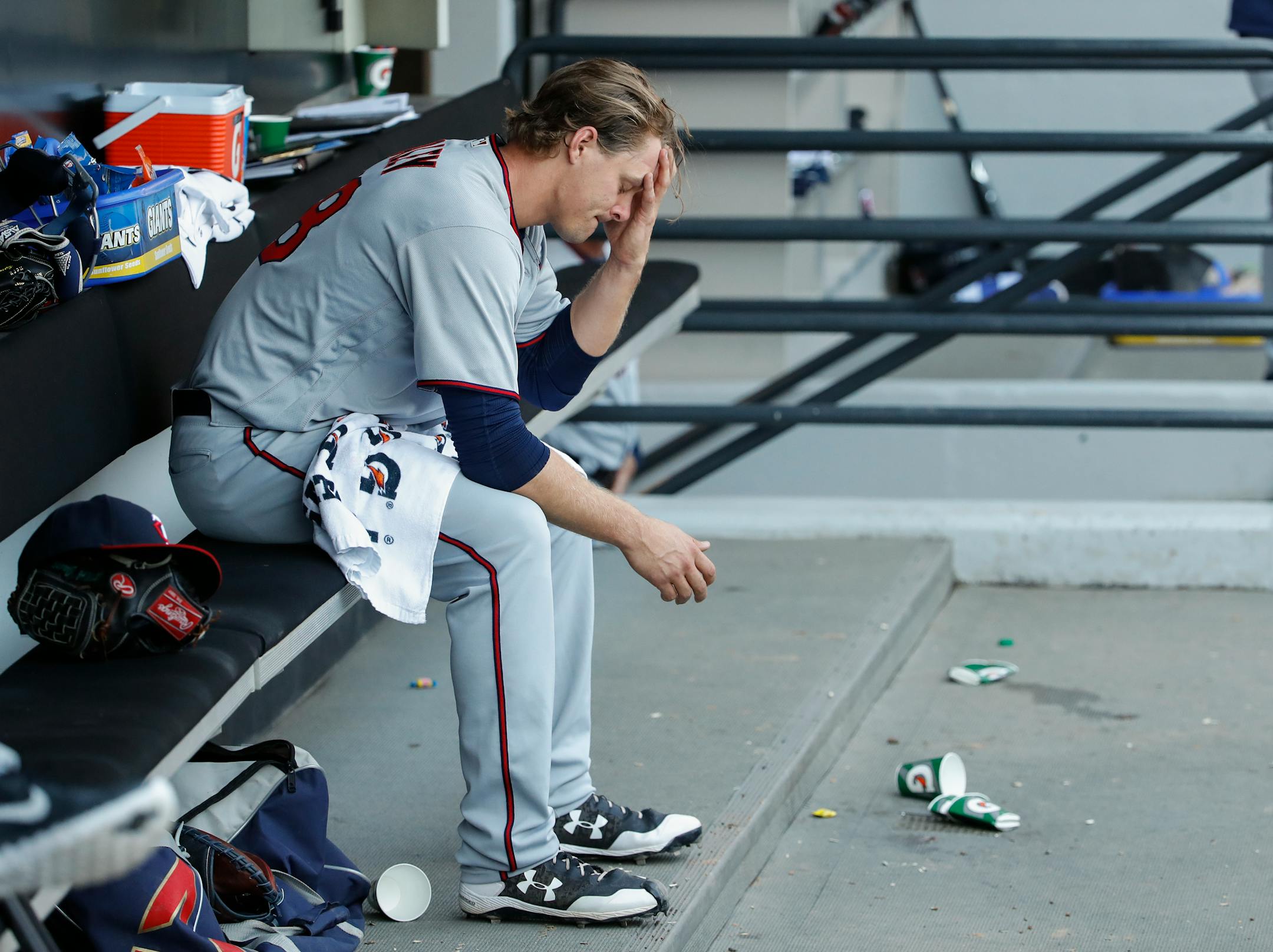 Minnesota Twins relief pitcher Justin Haley sits in a dugout after being taken out of a baseball game during the sixth inning against the Chicago White Sox, Saturday, April 8, 2017, in Chicago. (AP Photo/Kamil Krzaczynski)