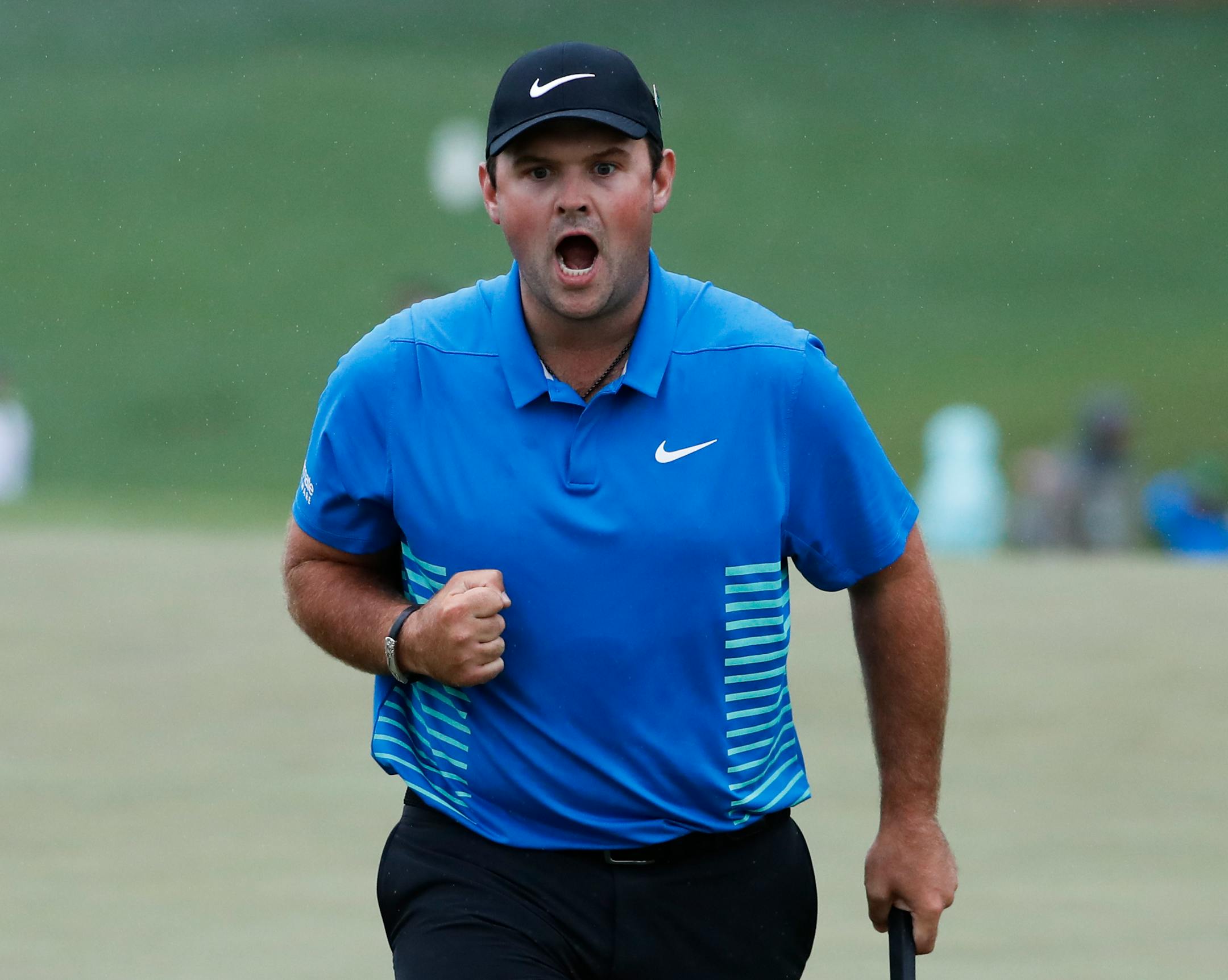 Patrick Reed reacts after making a birdie putt on the ninth hole during the third round at the Masters