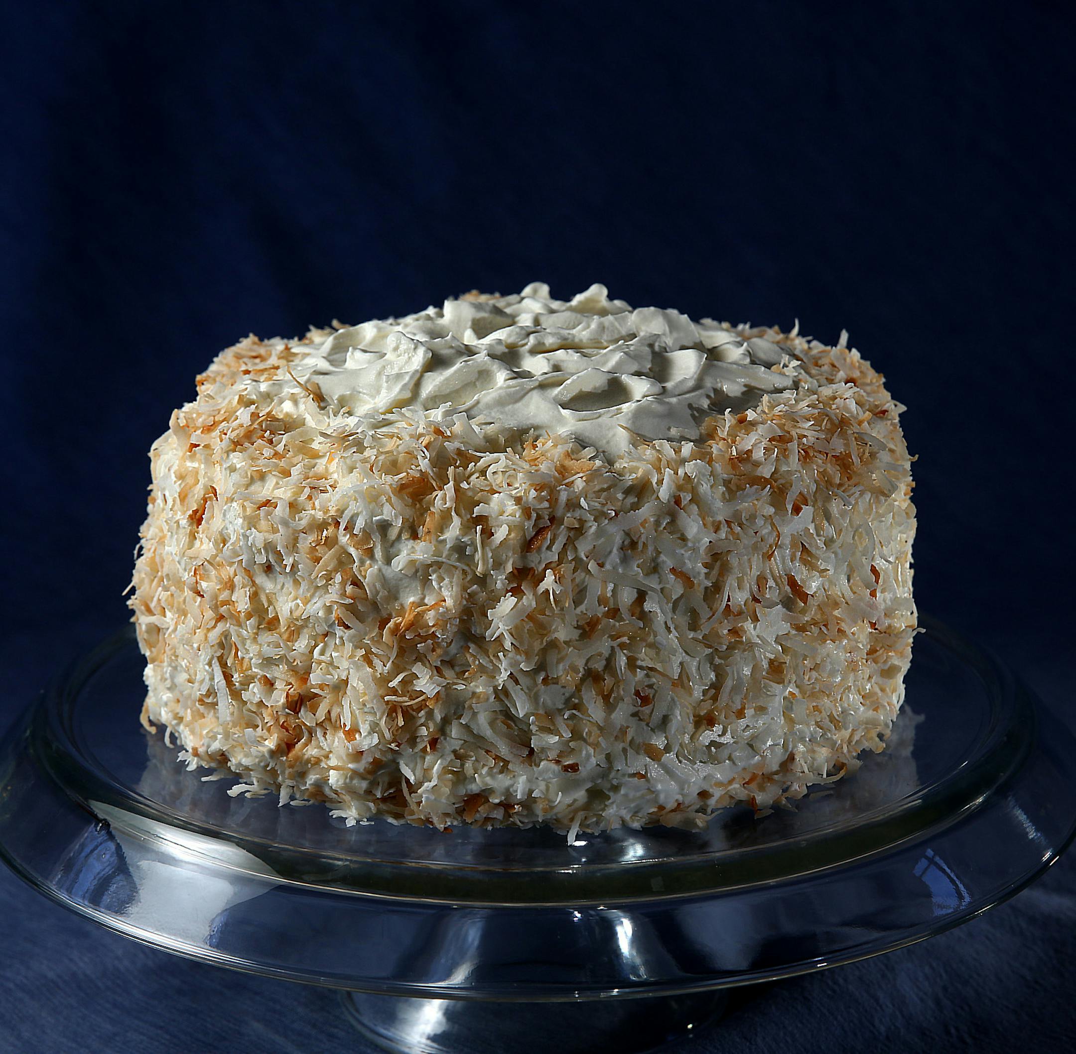 Coconut cake.] JIM GEHRZ ‚Ä¢ jgehrz@startribune.com / Minneapolis, MN / April 4, 2014 / 1:00 PM BACKGROUND INFORMATION: Reporter Kim Ode bakes a coconut cake for Baking Central, complete with step-by-step photos showing the making of batter and custard, assembling and decorating.