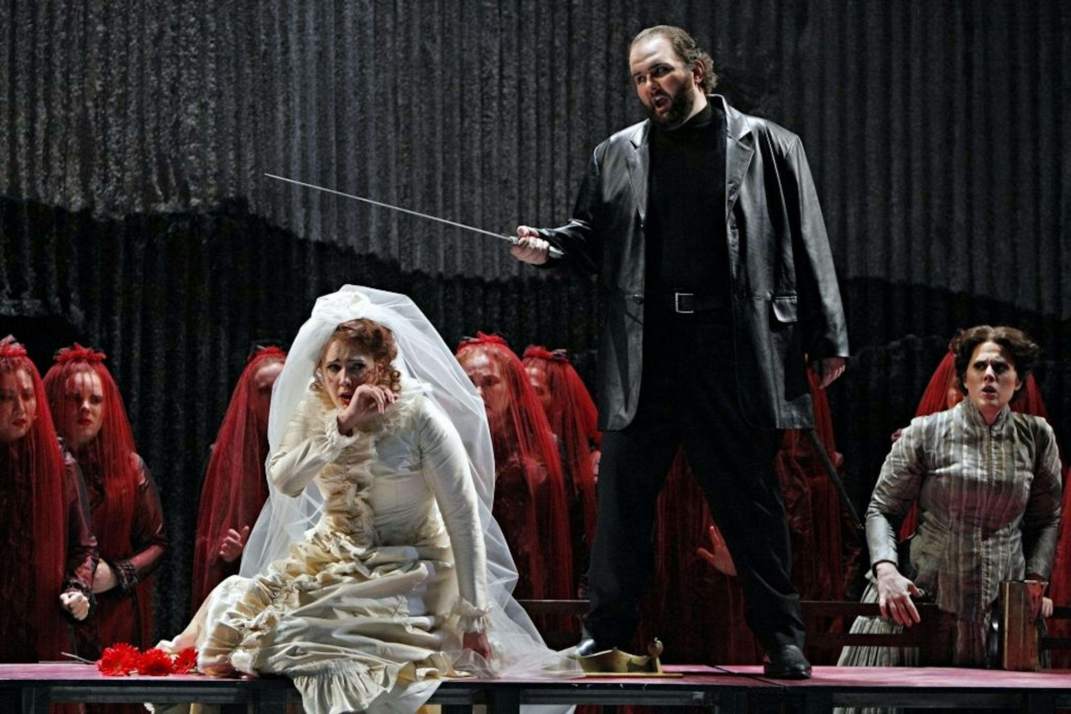 An unhappy wedding day for Lucia (Susanna Phillips) and Arturo (A. J. Glueckert), in Donizetti's "Lucia di Lammermoor." At far right is Alisa (Victoria Vargas).