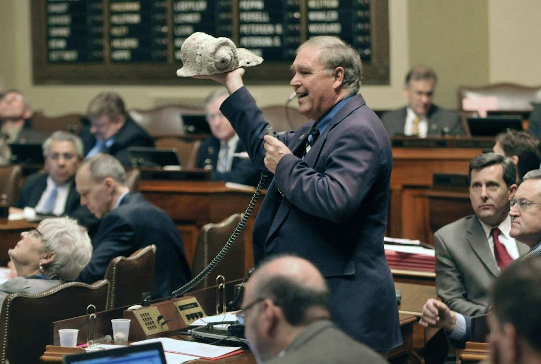 Rep. Dean Urdahl, R-Grove City, held up Thursday a broken piece from the facade of the Capitol to illustrate the building's condition. A bonding bill that included money to renovate the Capitol failed 80-50.