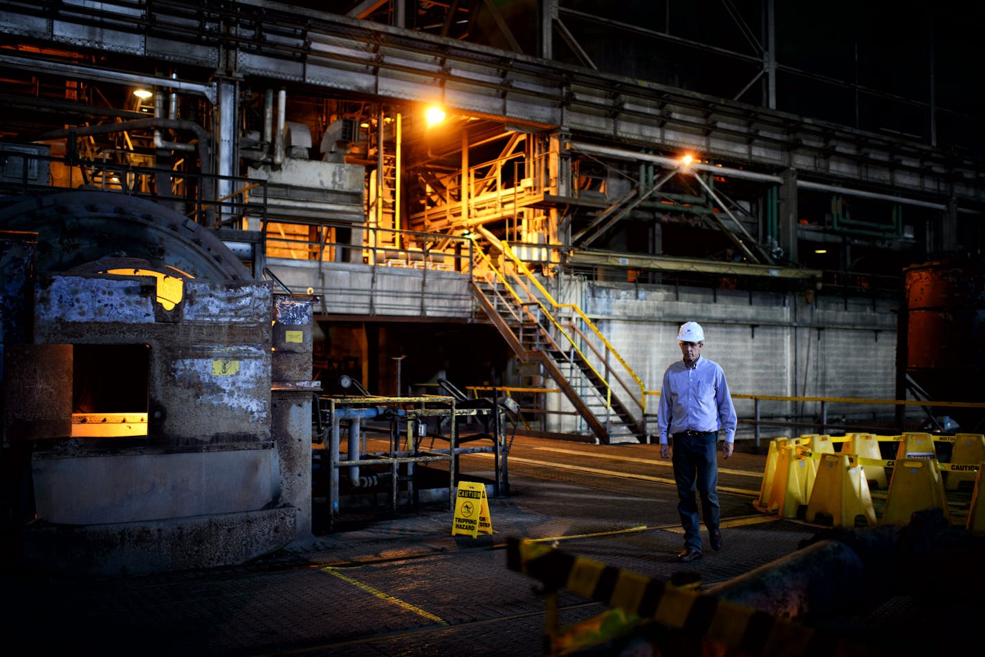 Bruce Richardson, V.P. for corporate communications walked in the crusher Building at PolyMet Mine where rock chunks containing ore will be pulverized in these mills. PolyMet Mine in Hoyt Lakes, Minn. has been mired in a permitting battle for over eight years and the issue has become politicized in the state and particularly in the eighth congressional district. ] Hoyt Lakes, MN -- Wednesday, August 20, 2014. GLEN STUBBE * gstubbe@startribune.com