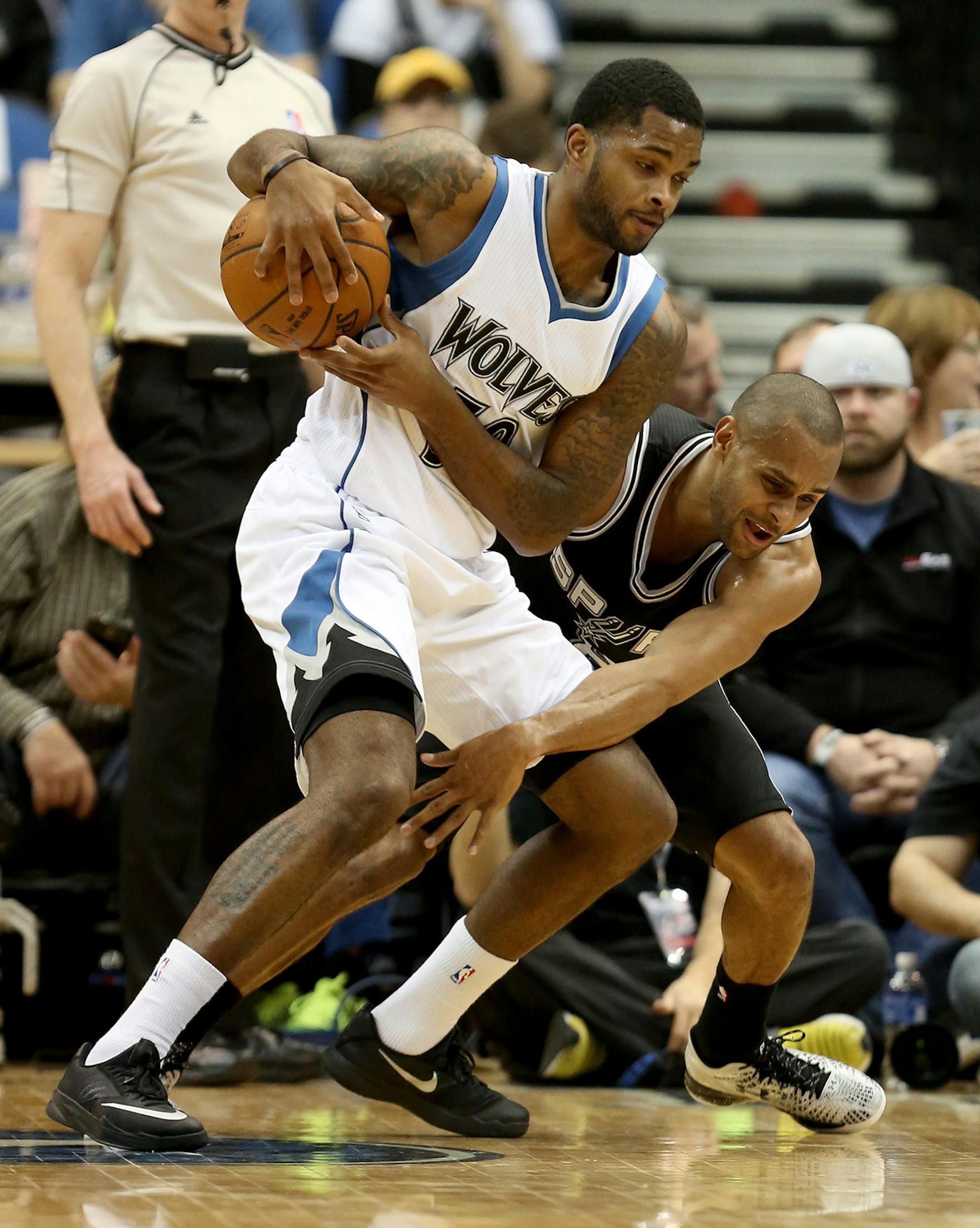 The Wolves Troy Daniels grabbed the ball away from the Spurs Patty Mills during the second half. ] (KYNDELL HARKNESS/STAR TRIBUNE) kyndell.harkness@startribune.com Timberwolves vs San Antonio at the Target Center in Minneapolis Min., Saturday, January 10, 2014. Spurs won over the Wolves 108-93.