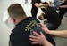 During a busy night at the VFW Post #246 in Minneapolis, veteran Shane Johnson of Minneapolis gets a deep massage from Massage Therapist Rachel Knieff