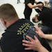 During a busy night at the VFW Post #246 in Minneapolis, veteran Shane Johnson of Minneapolis gets a deep massage from Massage Therapist Rachel Knieff