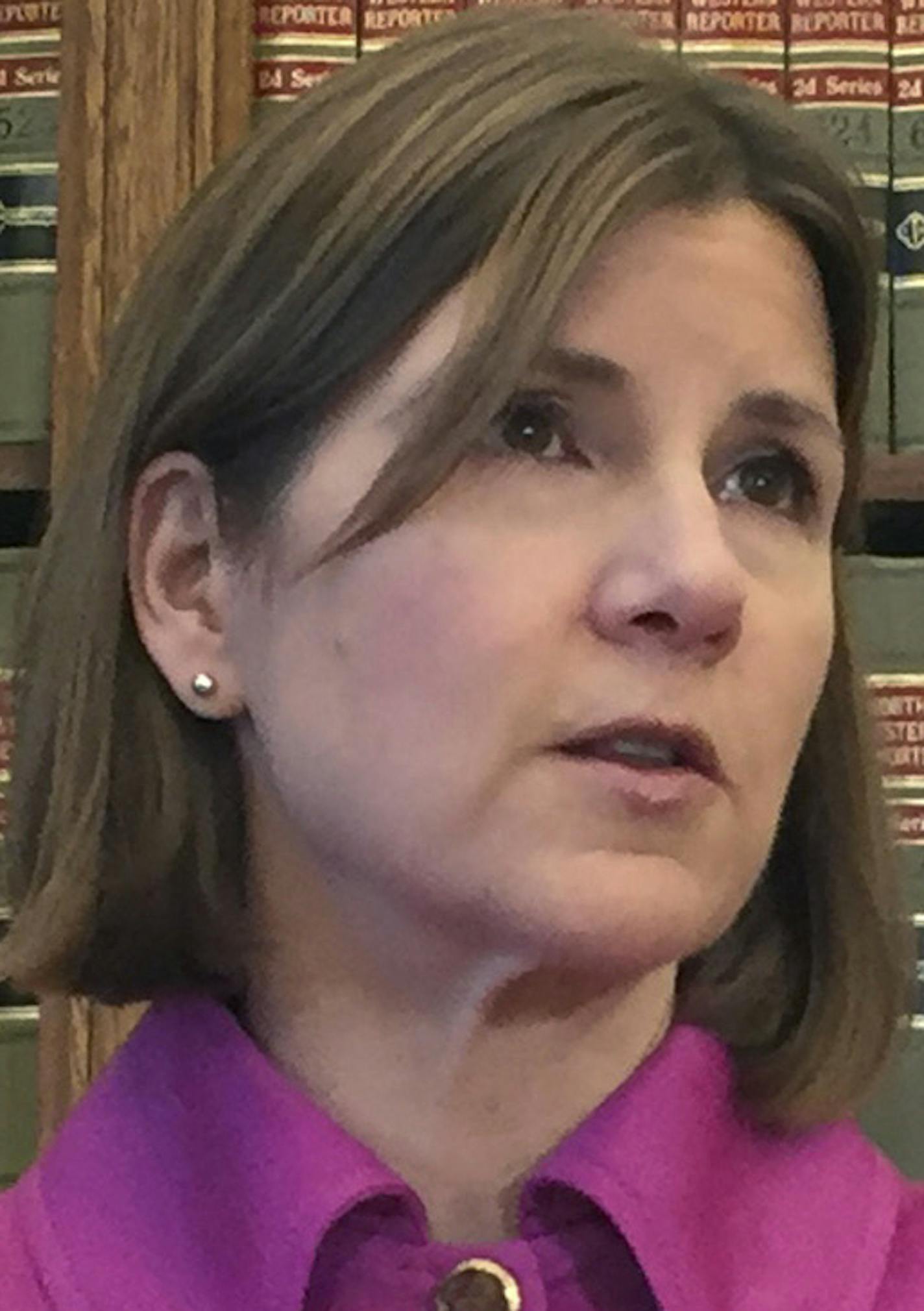 Minnesota Attorney General Lori Swanson announces she'll join a lawsuit with California and other states challenging President Donald Trump's decision to halt payments to insurers that had helped hold premiums down for people buying insurance under the Obama-era health care law on Friday Oct. 13, 2017, in St. Cloud, Minn. (AP Photo/Kyle Potter)