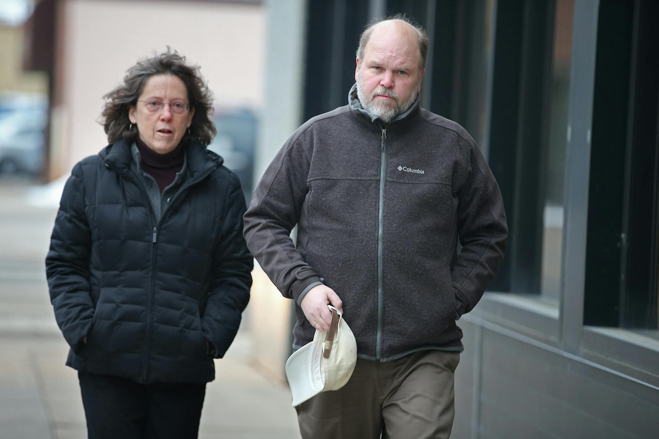 Mike Brue, the half brother of Officer Scott Patrick, made his way into the Stearns County District Courthouse for the opening statements in the Brian G. Fitch trial, Tuesday, January 20, 2015. Brian G. Fitch is on trial for killing Officer Scott Patrick last year.