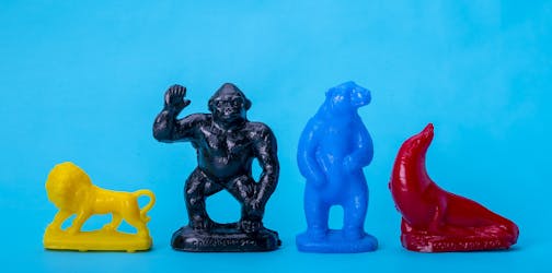 A plastic lion, gorilla, polar bear and sea lion from Como Zoo's Mold-A-Rama machine.