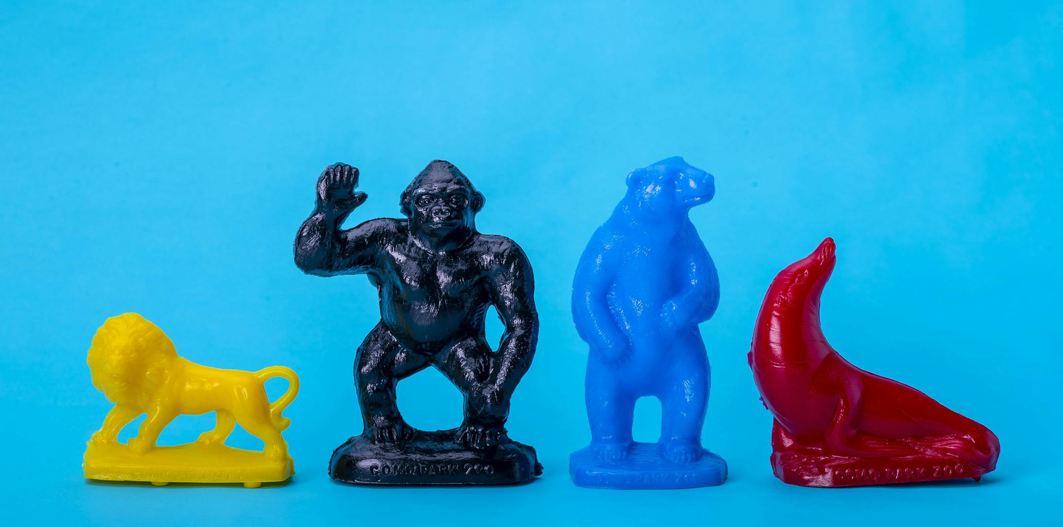 A plastic lion, gorilla, polar bear and sea lion from Como Zoo's Mold-A-Rama machine.