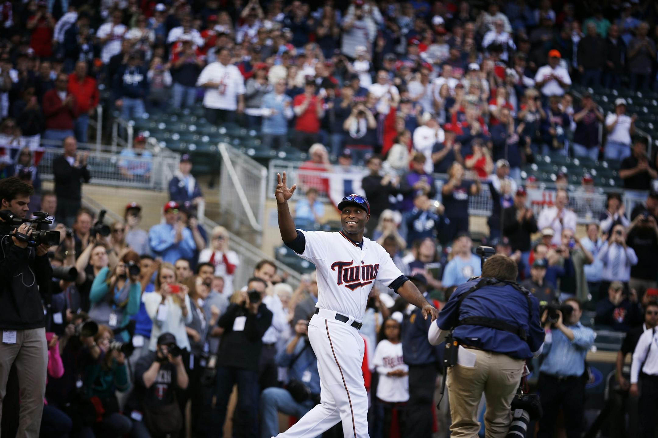 Torii Hunter enters to field to a standing ovation as he is introduced before the Twins home opener against the Kansas City Royals at Target Field in Minneapolis on Monday, April 13, 2015.
