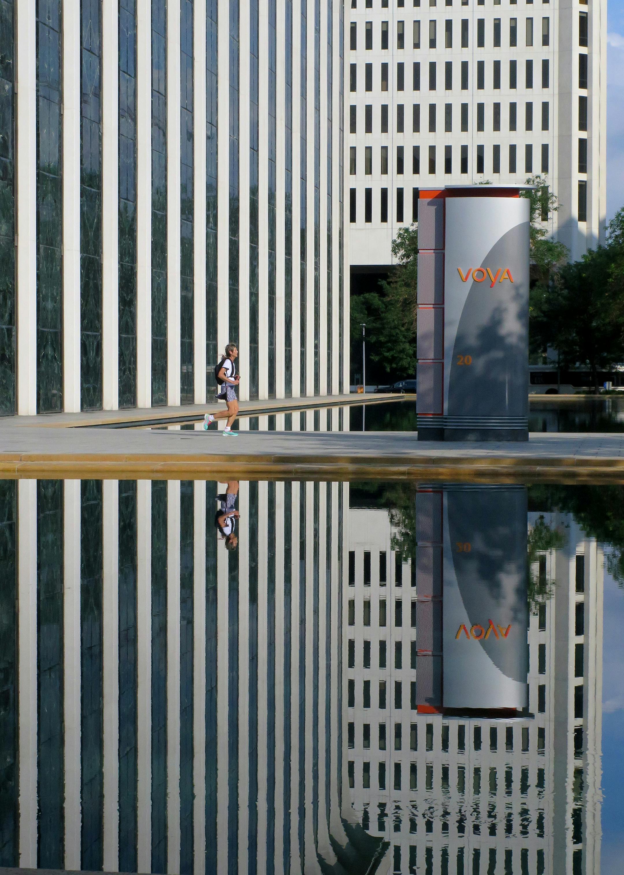 Buildings included in the sale of ' Washington Square' in downtown Minneapolis included the two in this photo, - 20 Washington ( foreground ) Minoru Yamasaki's NWNL Building (1964 ) currently occupied by Voya Financial and 100 Washington,- vertical tower background. ] Tom Sweeney, Minneapolis, MN 8/21/2014