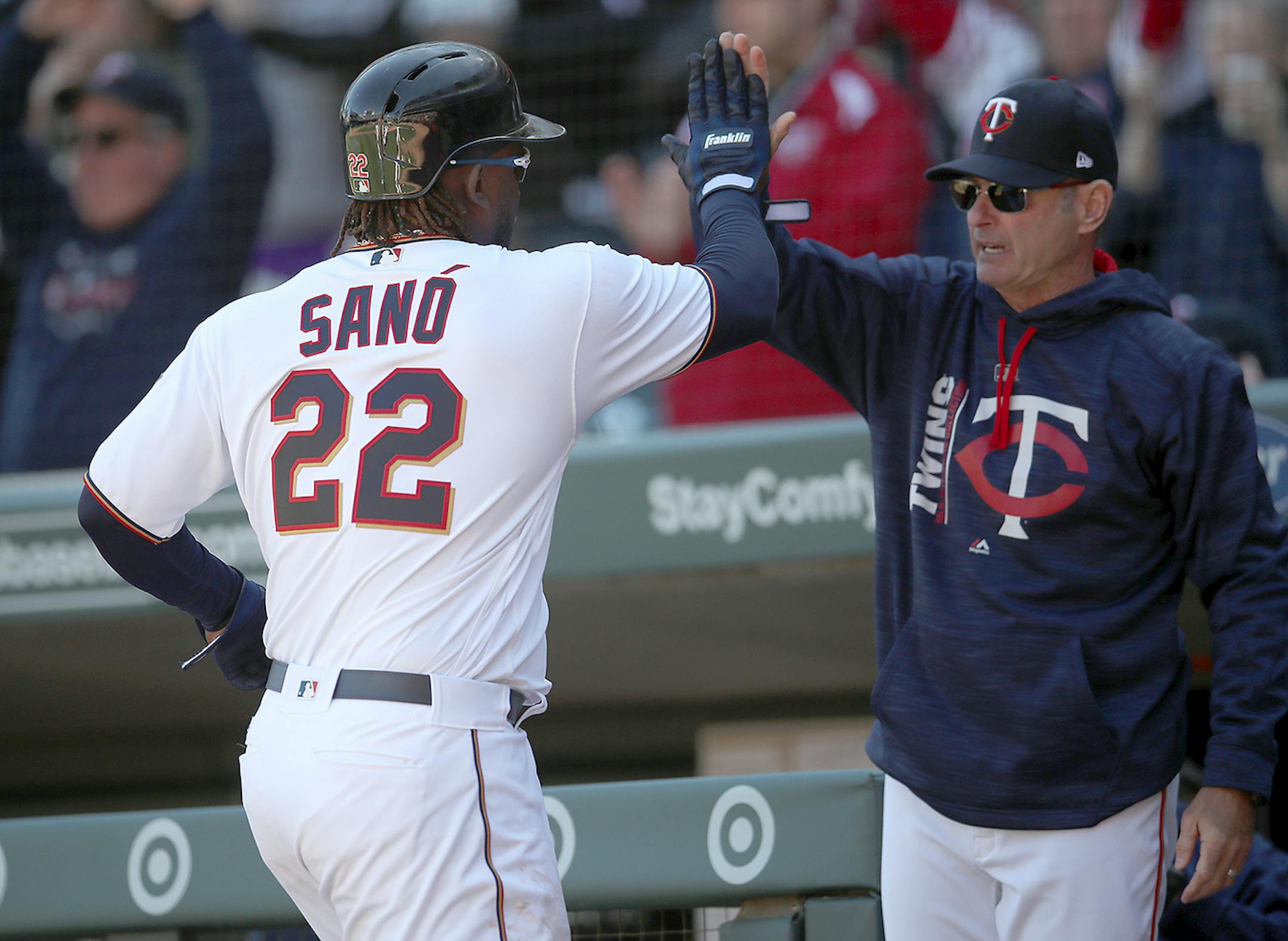 Miguel Sano was greeted by Twins Manager Paul Molitor after scoring a run during the seventh inning as the Twins took on the Royals at Target Field, Thursday, April 6, 2017 in Minneapolis, MN.