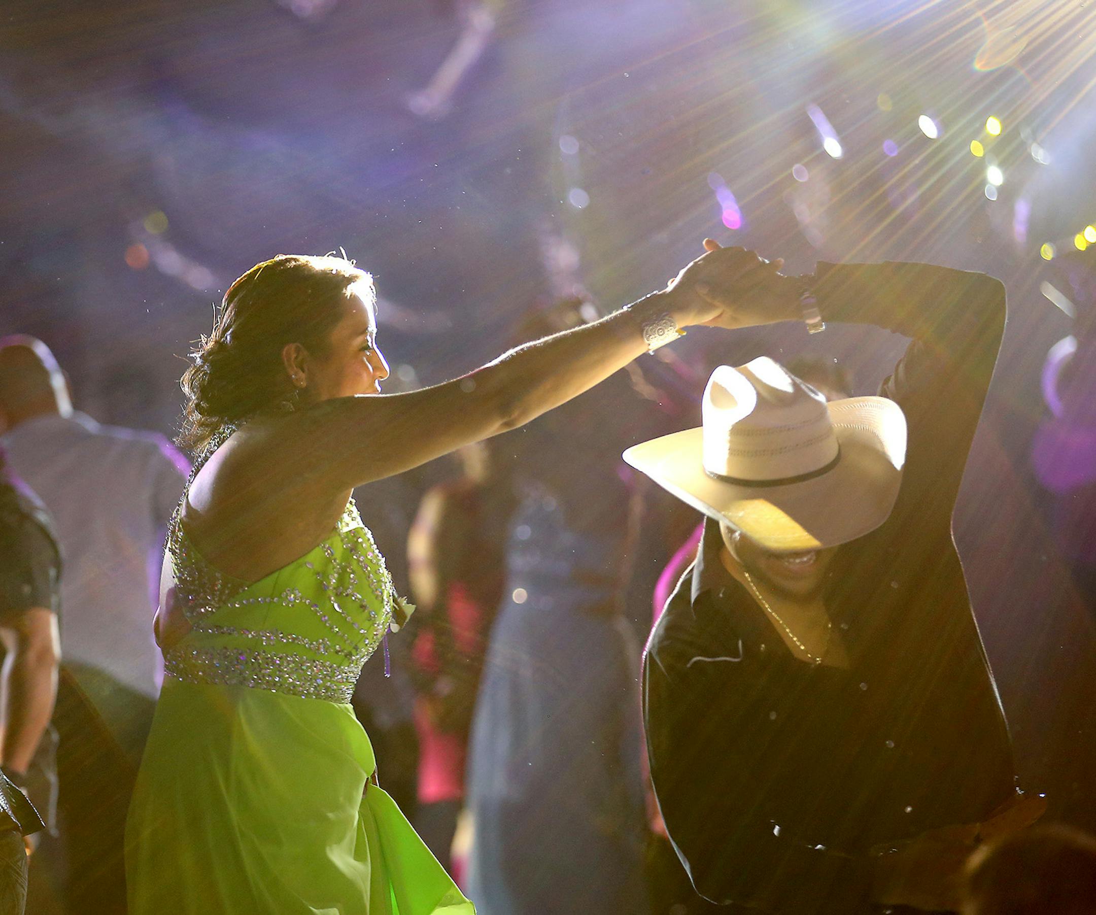 Guests took to the dance floor, including Lizeth's mother Patricia Oman during her Quinceañera celebration at the West St. Paul Armory, Saturday, June 20, 2015. ] (ELIZABETH FLORES/STAR TRIBUNE) ELIZABETH FLORES • eflores@startribune.com
