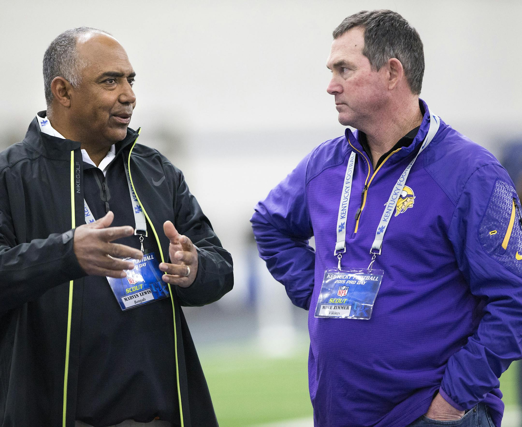 Cincinnati Bengals head coach Marvin Lewis, left, and Minnesota Vikings head coach Mike Zimmer, chat with each other during NFL football Pro Day at the University of Kentucky in Lexington, Ky., Thursday, March 12, 2015. (AP Photo/David Stephenson) ORG XMIT: MIN2015032101100825