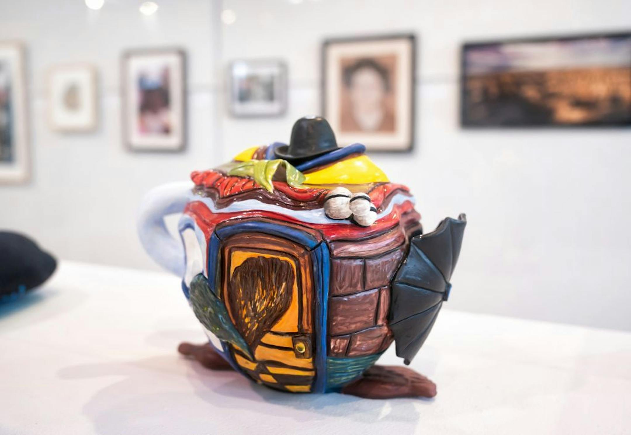 Tea With Rene Magritte by Kari O. Halker-Saathoff, low fire white clay, underglazes and acrylic.