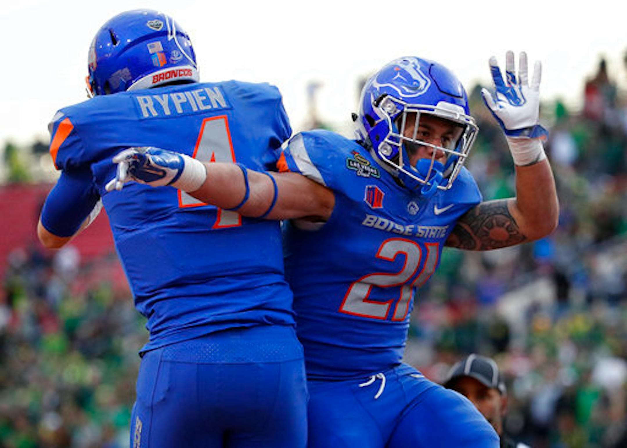 Boise State running back Ryan Wolpin, right, celebrates with quarterback Brett Rypien after Wolpin scored against Oregon during the second half of the Las Vegas Bowl NCAA college football game Saturday, Dec. 16, 2017, in Las Vegas. (AP Photo/John Locher)