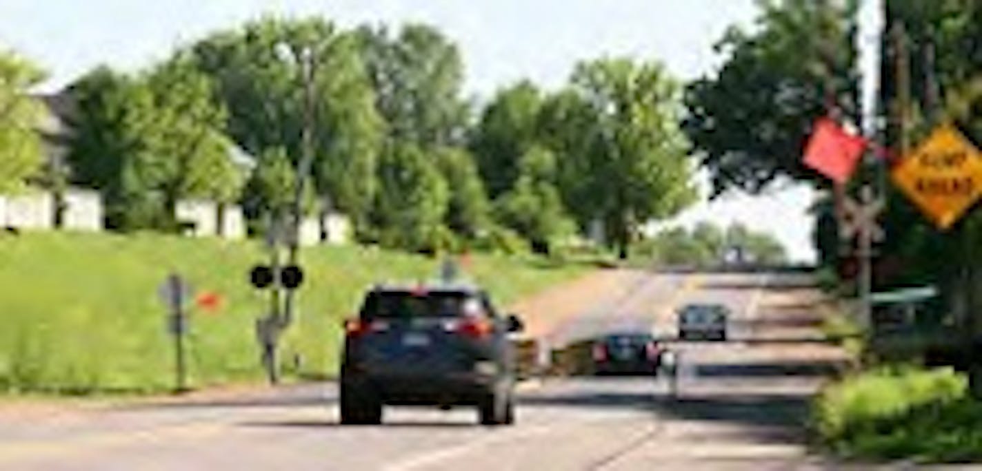 Photo courtesy of the City of Plymouth. The Vicksburg Lane railroad crossing where a bridge will be built to make it safer for cars.