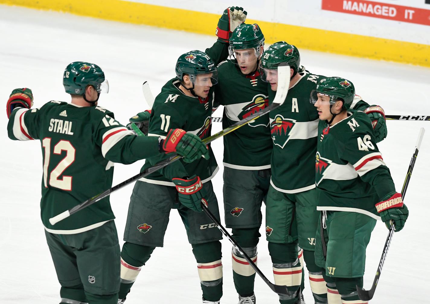 Minnesota Wild, from left, Eric Staal, Zach Parise, Charlie Coyle, Ryan Suter and Jared Spurgeon celebrate Spurgeon's goal in the first period of an NHL hockey game Saturday, Jan. 20, 2018, in St. Paul, Minn. (AP Photo/Tom Olmscheid)