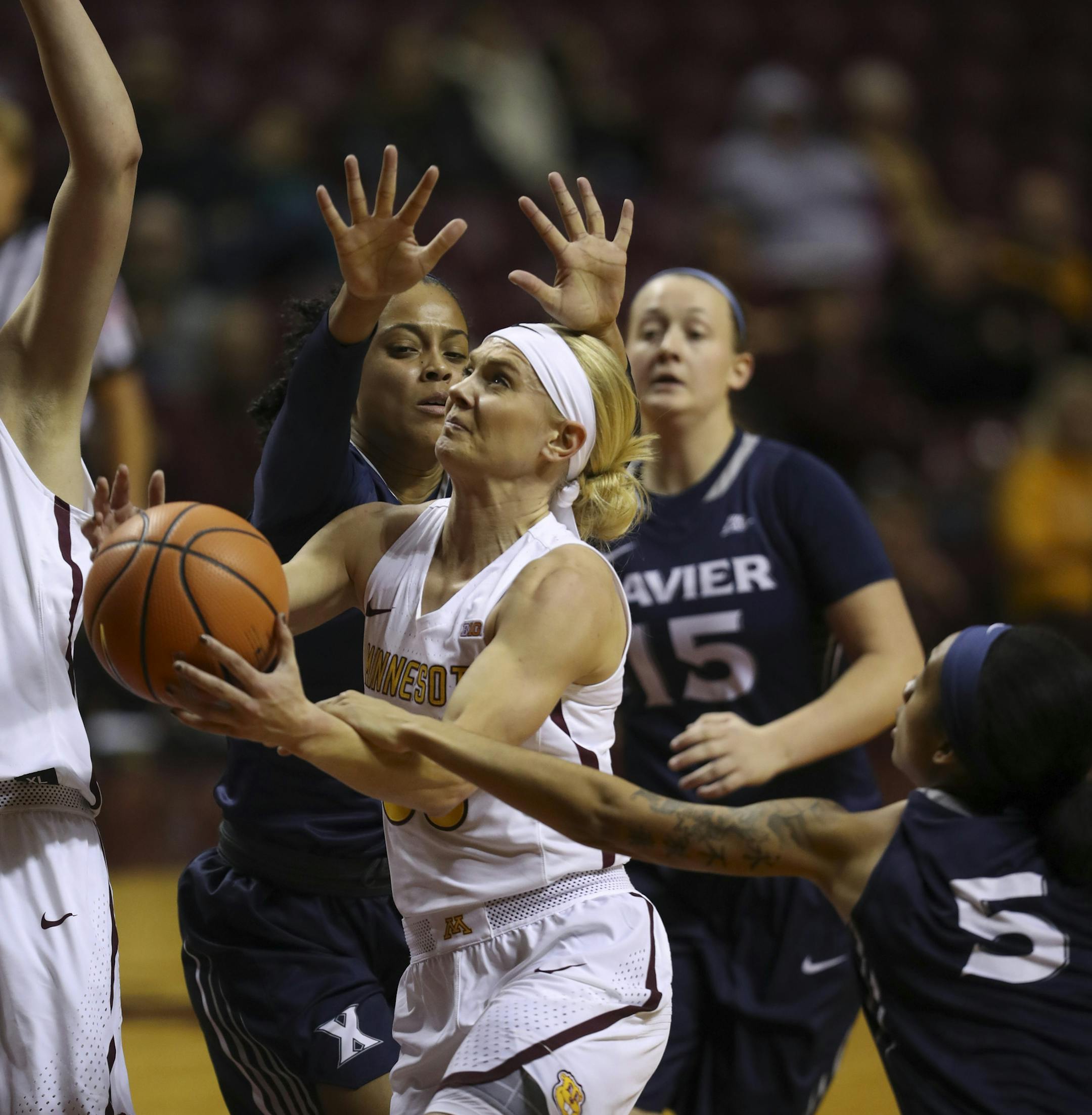 Minnesota Gophers guard Carlie Wagner (33) was fouled by Xavier Musketeers guard Princess Stewart (5) as she drove to the net in the first quarter. ] JEFF WHEELER ï jeff.wheeler@startribune.com The University of Minnesota women's basketball team faced Xavier an an NCAA basketball game Wednesday night, November 22, 2017 at Williams Arena in Minneapolis.