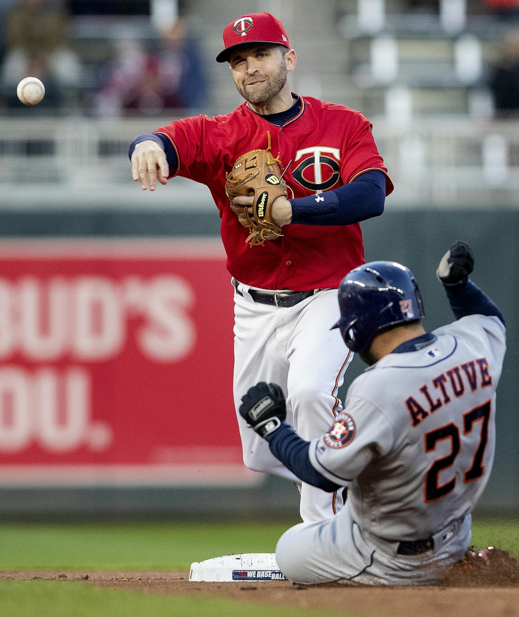 Twins second baseman Brian Dozier turned a double play in the first inning.