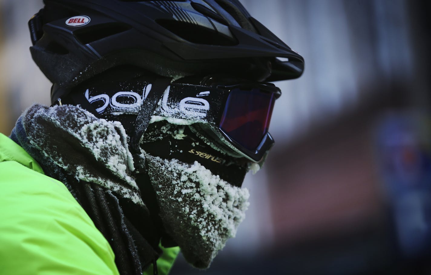 Seth Leventhal, originally from Hartford, Conn., perhaps wished he was still on the East Coast as he waited at a stop light while commuting downtown by bike Tuesday, Jan. 28, 2014, in Minneapolis.