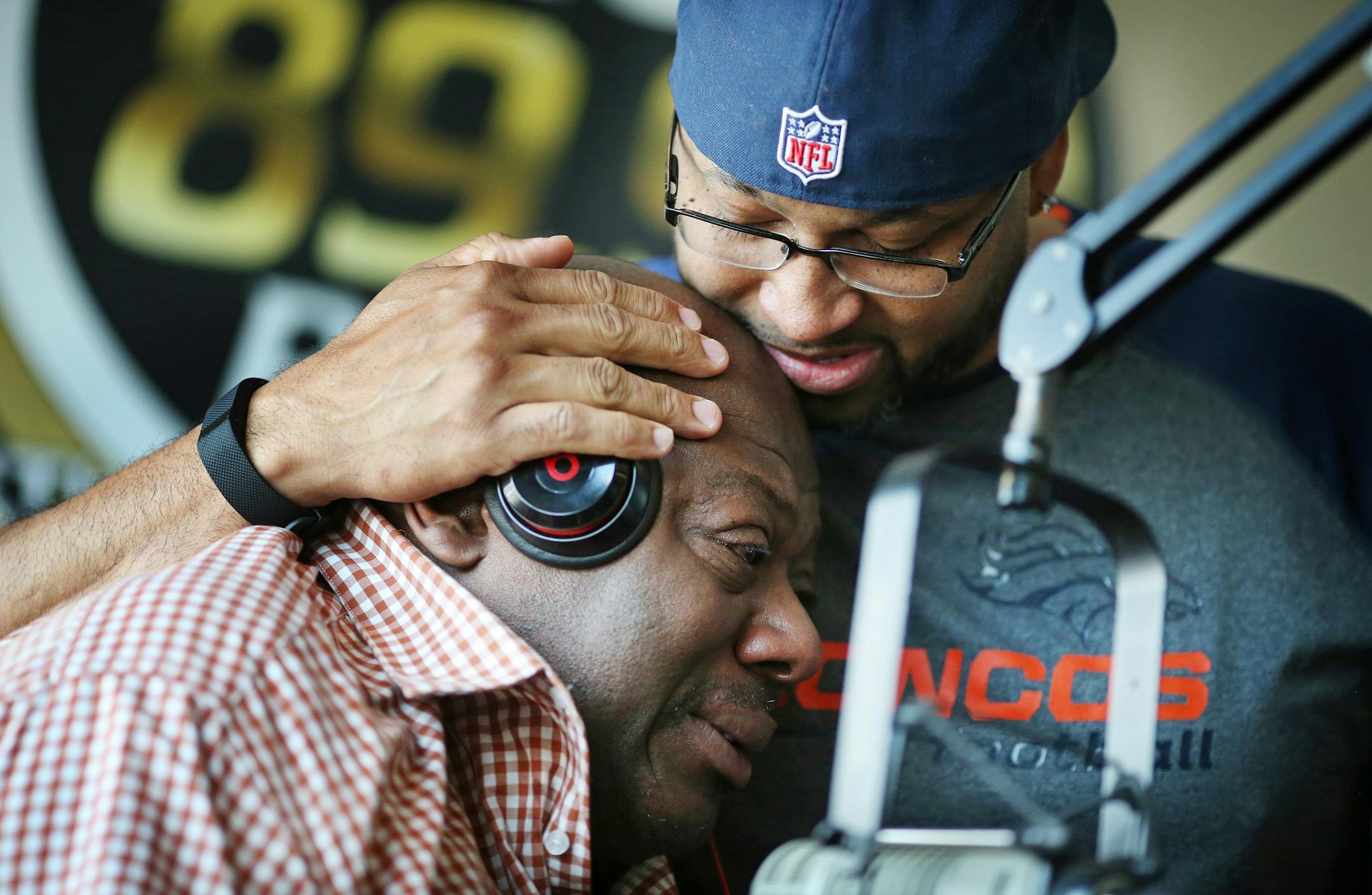KMOJ host of afternoon drive time show Walter Q Bear Banks left and Shed G embraced each other as they talked about the death of Prince Thursday April 21, 2016 Minneapolis, MN.