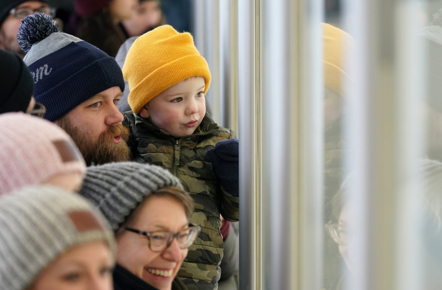 Anders Dybdahl of St. Louis Park held his son Caleb, 3, as they watched through the glass during the Wild's outdoor practice Thursday. ] ANTHONY SOUFFLE &#x2022; anthony.souffle@startribune.com The Minnesota Wild held an outdoor practice open to the public Thursday, Jan. 2, 2020 at the Recreation Outdoor Center (ROC) in St. Louis Park, Minn. On Wednesday the NHL announced that the 2021 Bridgestone NHL Winter Classic will feature the Minnesota Wild on Jan. 1, 2021, outdoors at Target Field in Min