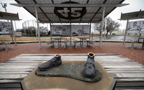 FILE - A bronze statue of legendary baseball pioneer Jackie Robinson was stolen from a park in Wichita, Kan., during the early morning hours of Thursd