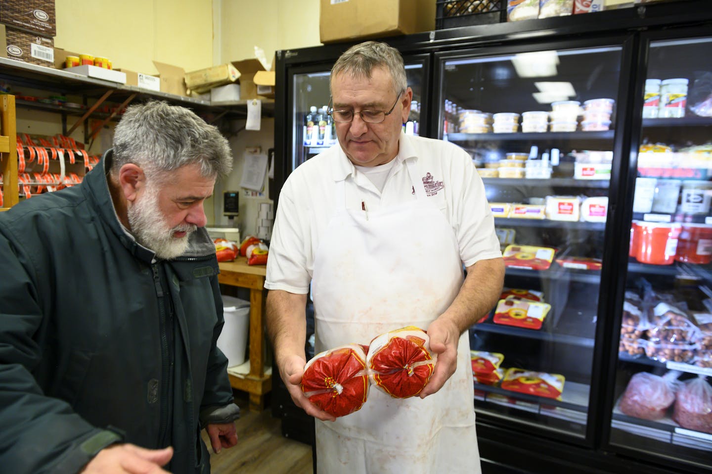 Jim Schumacher, a Hackenmueller's employee of 38 years, showed longtime customer Bruce Center a pair of\ chickens he'd go on to sell him Friday afternoon. ] Aaron Lavinsky &#x2022; aaron.lavinsky@startribune.com A strip of Broadway Avenue in Robbinsdale is rapidly turning into a walkable "Eat Street" of locally-owned restaurants and shops. A new brewery now sits across from a popular Costa Rican joint. Down the block is Pig Ate My Pizza and the owners of The Bulldog will soon open a new casual d