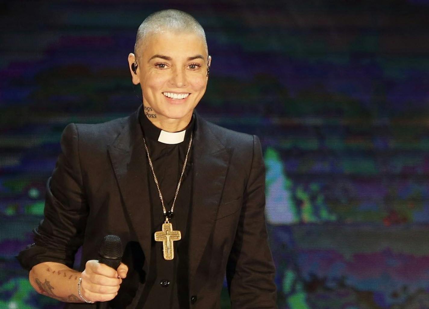 FILE - This is Oct. 5, 2014, file photo of Irish singer Sinead O'Connor performs during the Italian State RAI TV program "Che Tempo che Fa", in Milan, Italy. O'Connor emotionally pleaded for help and opened up about her struggles with mental illness in a rambling Facebook video posted on Aug. 3, 2017. A follow-up Facebook said to be made on O�Connor�s behalf late Monday said the singer was OK.