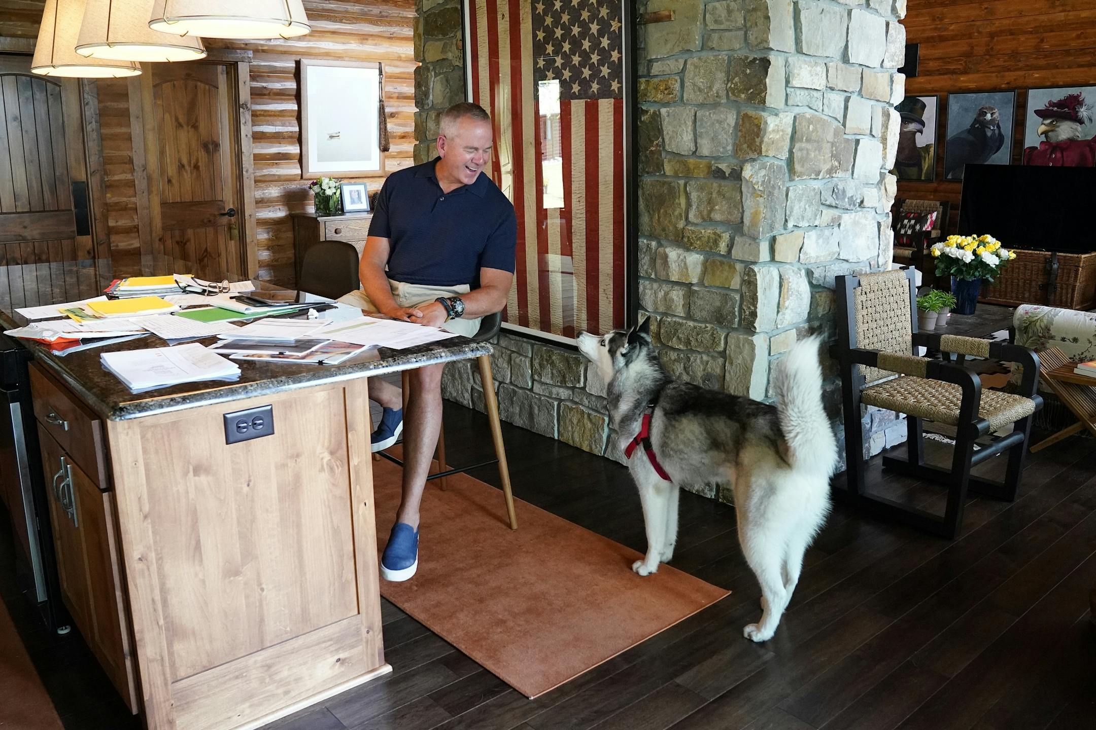 Todd Russell, a commercial real estate consultant from St. Paul, worked from his newly purchased lakefront home in East Gull Lake as his 1-year-old Siberian Husky Isabelle competed for his time.