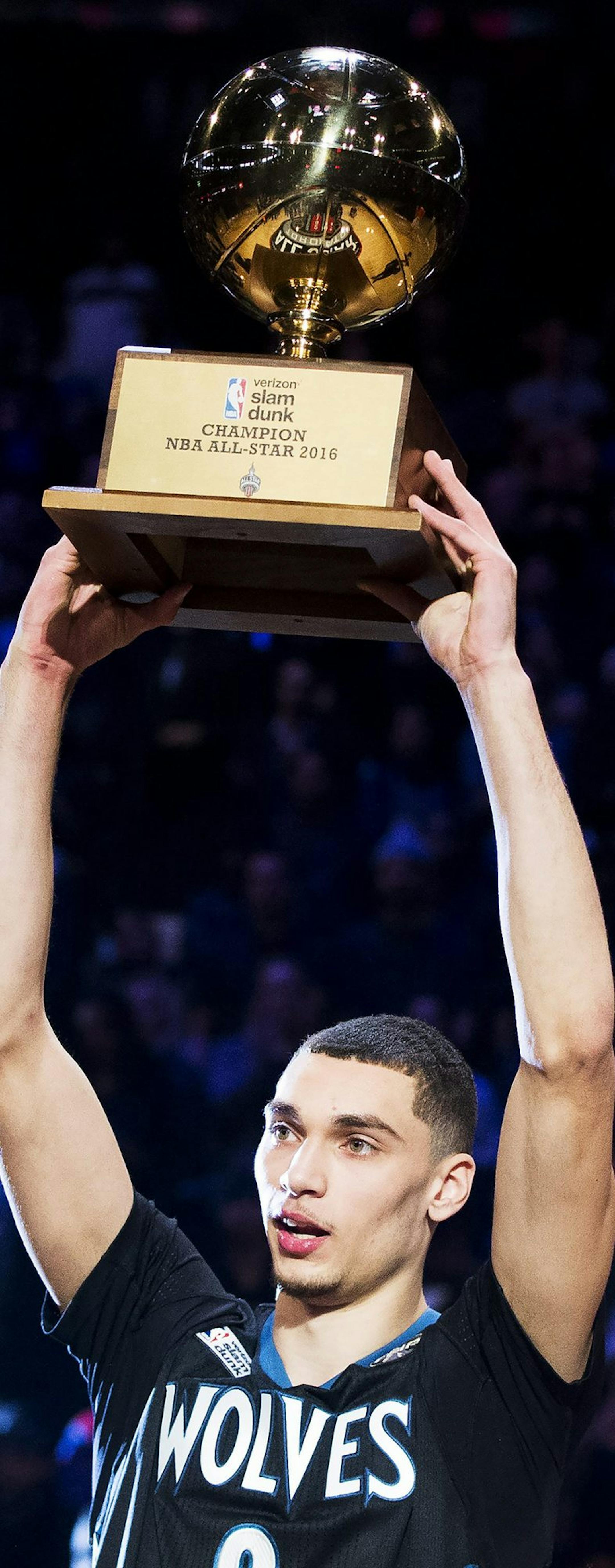 Minnesota Timberwolves' Zach LaVine hoists the trophy after winning the basketball slam dunk contest during the NBA All-Star weekend in Toronto, Saturday, Feb. 13, 2016. (Mark Blinch/The Canadian Press via AP) MANDATORY CREDIT ORG XMIT: MIN2016021400013280