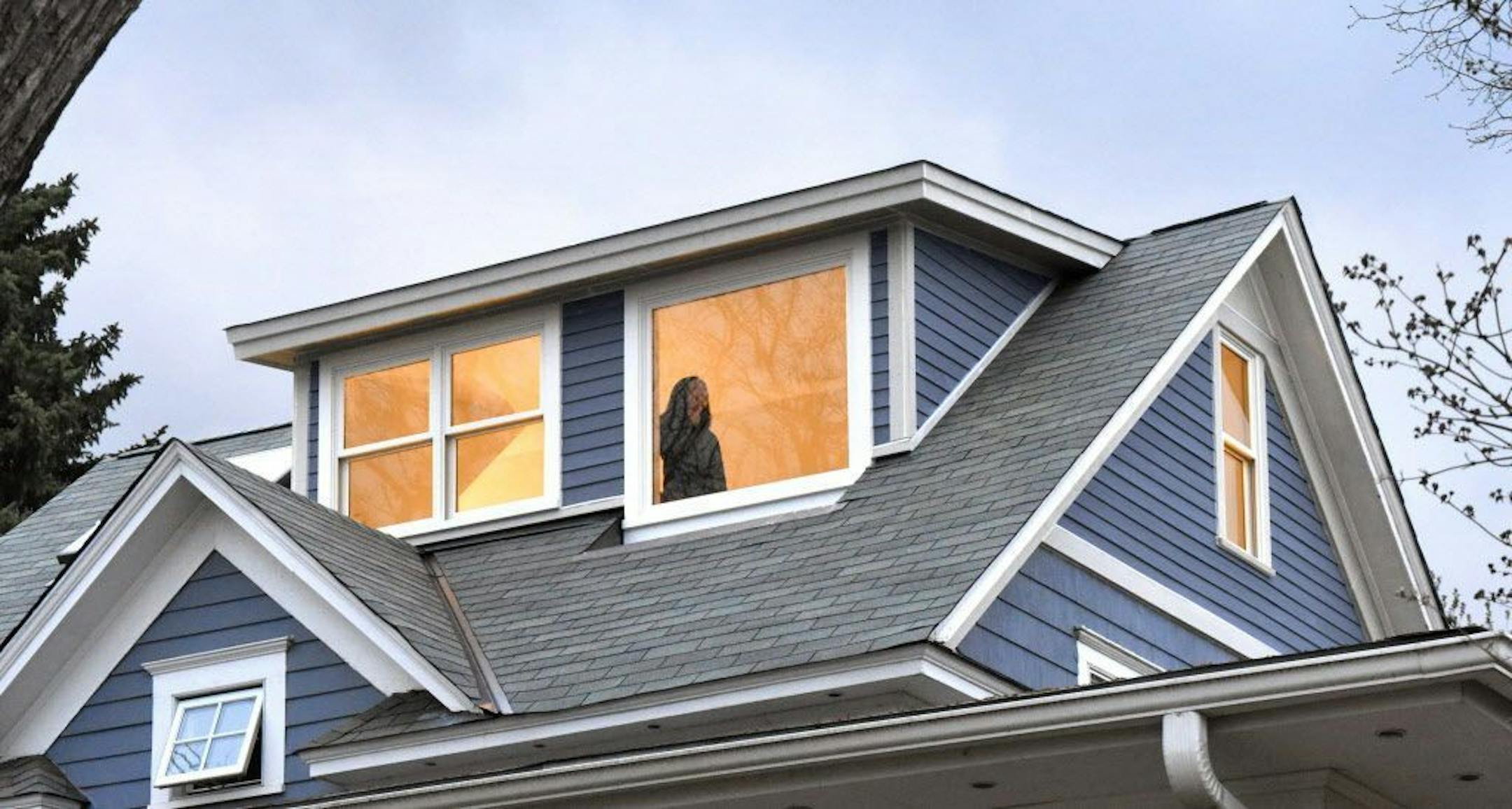 A west-facing shed dormer was built on the roof to increase headroom and draw in more natural light.