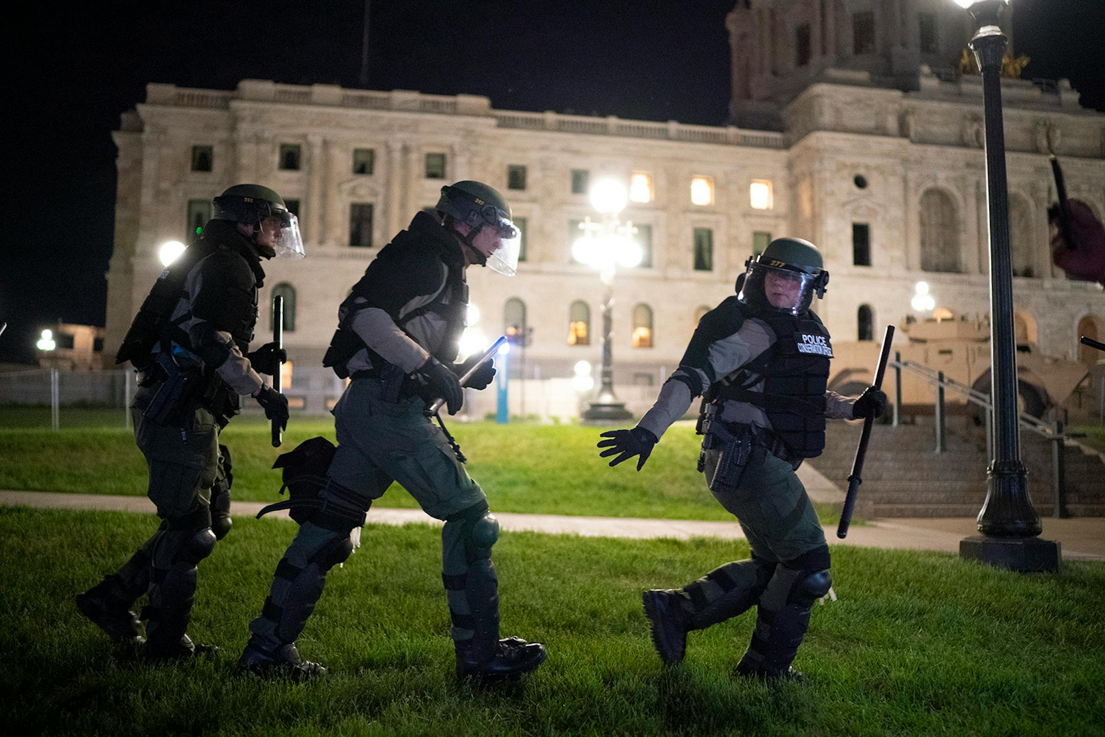 A group of state conservation officers were brought in to form a perimeter around the demonstrators as they were arrested.