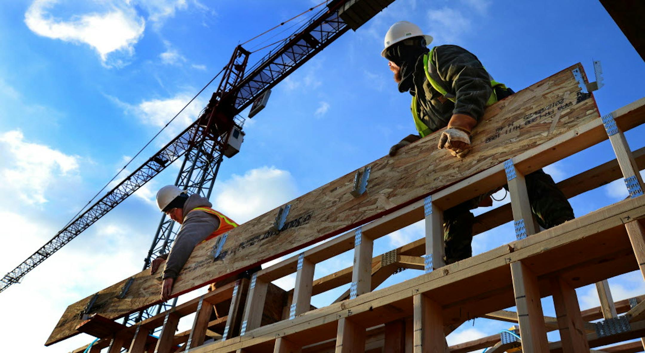 Central-city apartments continue to go up, but February saw a surge in metro area single-family building permits.