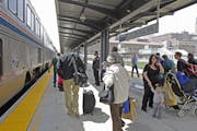 Passengers made their way off and onto the Amtrak at the Union Depot, Thursday, May 8, 2014 in St. Paul, MN. It is the first passenger train in more t