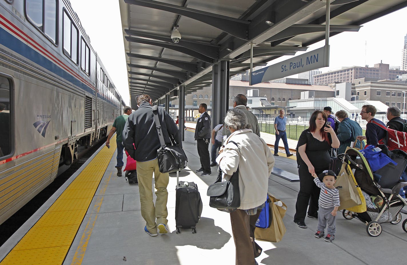 Passengers made their way off and onto the Amtrak at the Union Depot, Thursday, May 8, 2014 in St. Paul, MN. It is the first passenger train in more than 40 years to stop at the refurbished Union Depot.