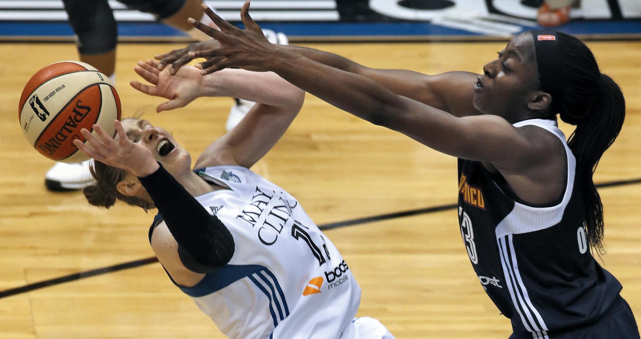 Lynx point guard Lindsay Whalen, left, was fouled by Sun defender Chiney Ogwumike in overtime, leading to Whalen making two free throws.